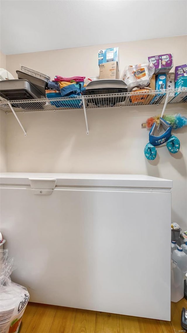 laundry area featuring light hardwood / wood-style flooring