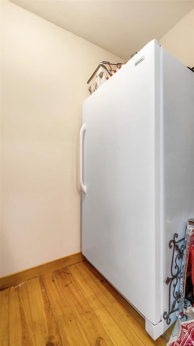 bathroom with wood-type flooring