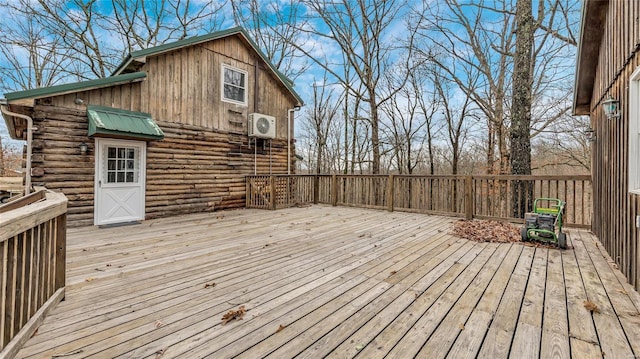 wooden terrace featuring ac unit