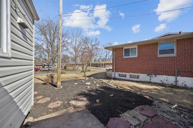 view of home's exterior featuring brick siding