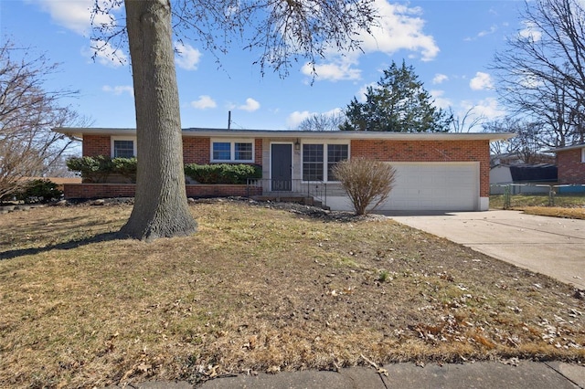 ranch-style house featuring a garage, concrete driveway, brick siding, and a front lawn