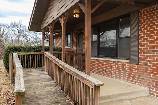 view of exterior entry featuring a deck