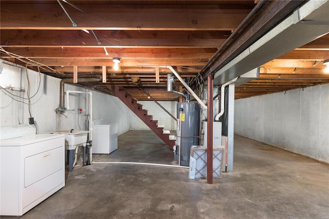 basement with washer / clothes dryer and water heater