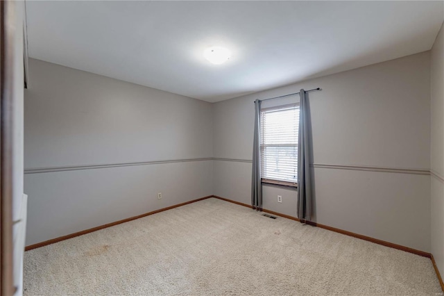 unfurnished room featuring carpet flooring