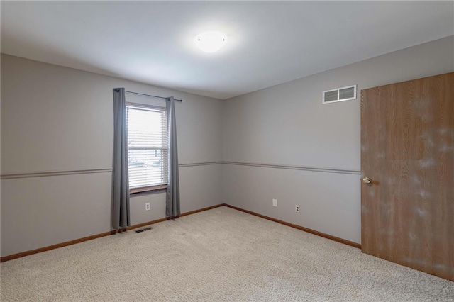 empty room featuring carpet flooring