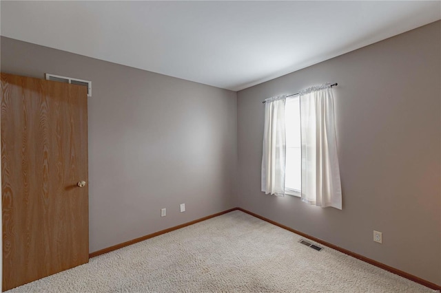 empty room featuring carpet floors