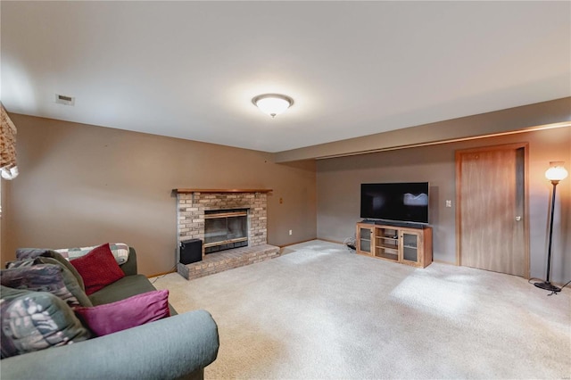 carpeted living room with a fireplace