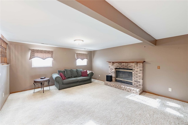 living room with a brick fireplace, carpet floors, and beamed ceiling