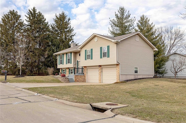 raised ranch with a garage and a front yard