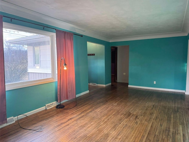 unfurnished room with hardwood / wood-style floors