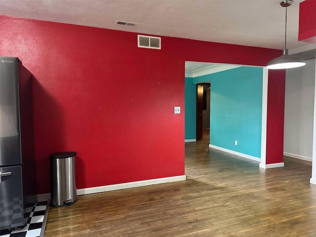 unfurnished room with dark wood-type flooring