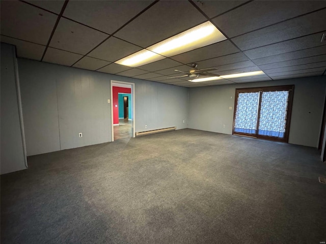 unfurnished room with carpet floors, a baseboard heating unit, a paneled ceiling, and ceiling fan