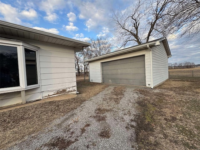 view of home's exterior with an outbuilding and a garage