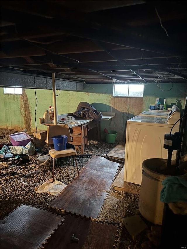 basement featuring wood-type flooring and washer / dryer