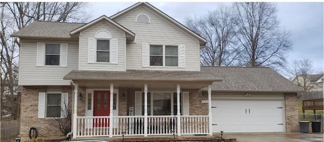 view of front of house with a garage and covered porch