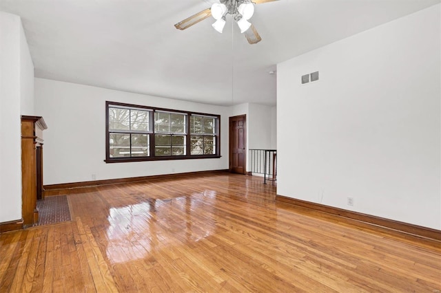 unfurnished living room featuring ceiling fan and light hardwood / wood-style floors