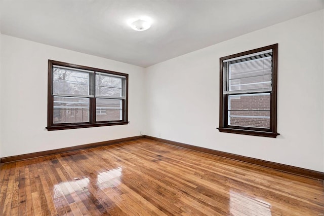 unfurnished room featuring hardwood / wood-style floors