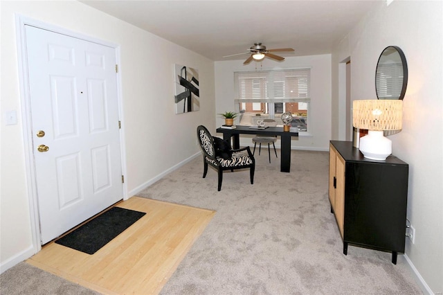 office featuring ceiling fan and light colored carpet