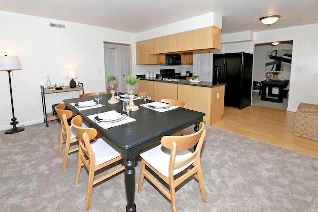 dining room featuring light wood-type flooring