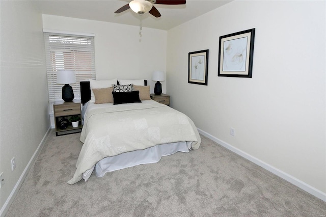 bedroom with light carpet and ceiling fan