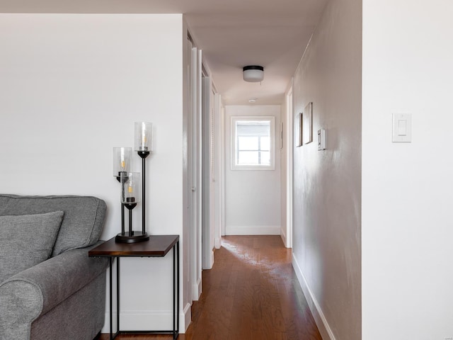 hall with hardwood / wood-style floors