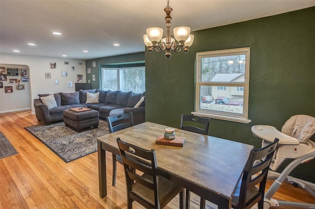 dining room featuring light hardwood / wood-style flooring and a chandelier