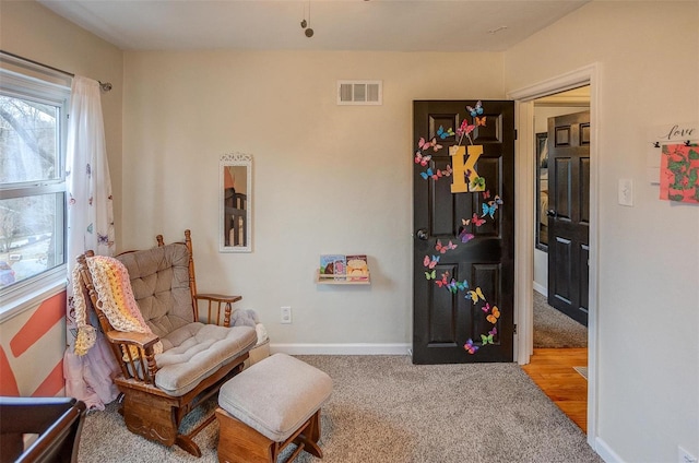 living area featuring carpet floors