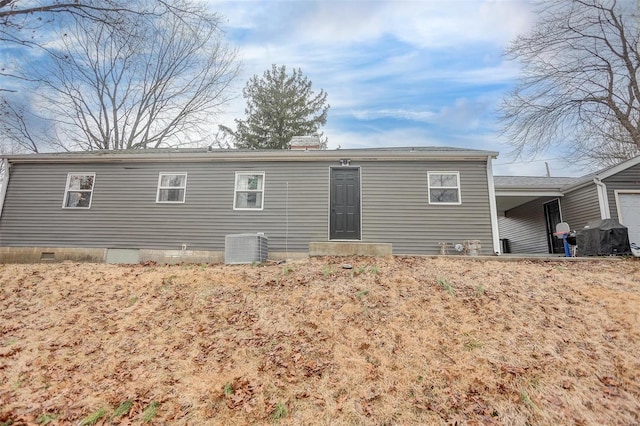 back of property with central AC unit