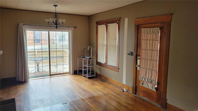 interior space featuring light hardwood / wood-style floors and a chandelier