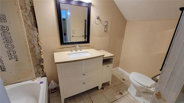 bathroom featuring lofted ceiling, tile patterned flooring, vanity, a tub, and toilet