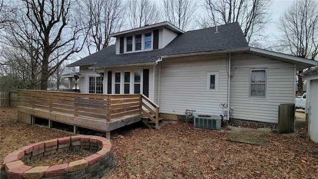 back of property with cooling unit and a deck