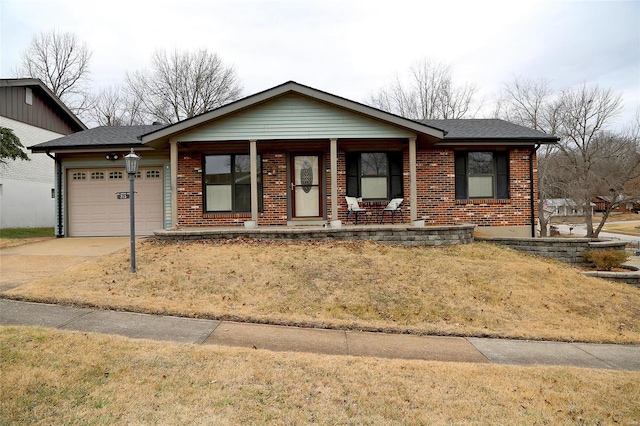 single story home featuring a garage and a front yard