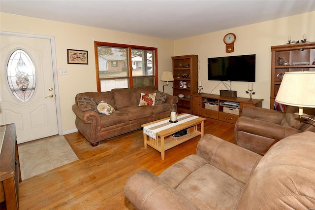 living room featuring plenty of natural light and light wood-type flooring