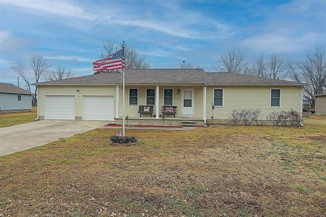 ranch-style house with a porch, a garage, and a front lawn