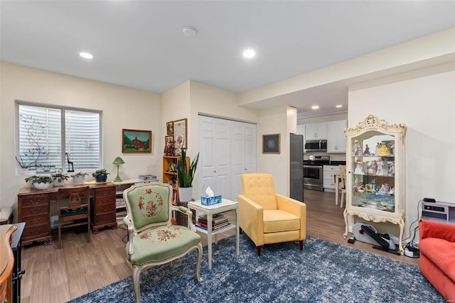 sitting room with hardwood / wood-style floors