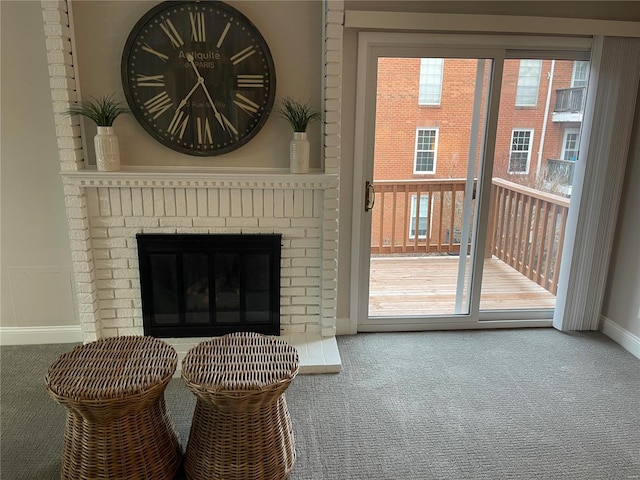 entryway with a healthy amount of sunlight, a fireplace, and carpet floors