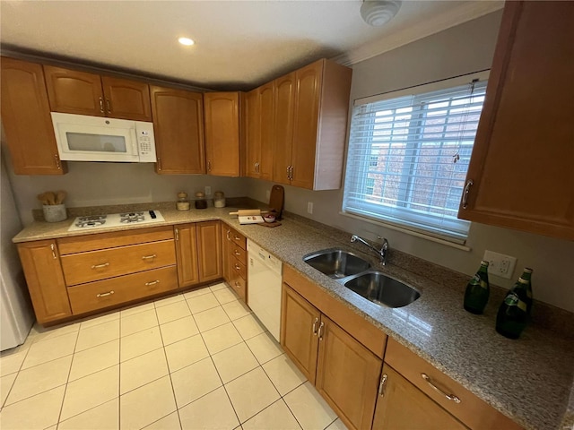 kitchen featuring sink, white appliances, and light tile patterned flooring