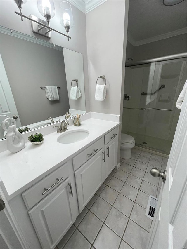 bathroom featuring tile patterned floors, toilet, an enclosed shower, crown molding, and vanity