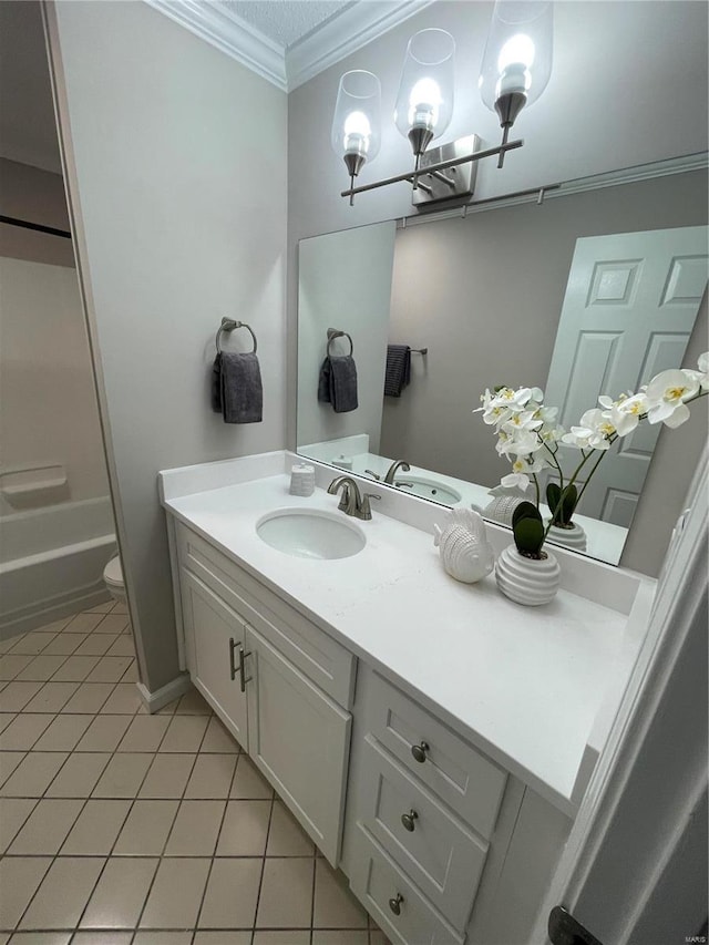 full bathroom featuring washtub / shower combination, tile patterned floors, toilet, ornamental molding, and vanity