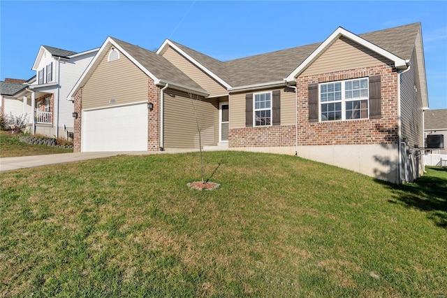 ranch-style house featuring a garage and a front lawn