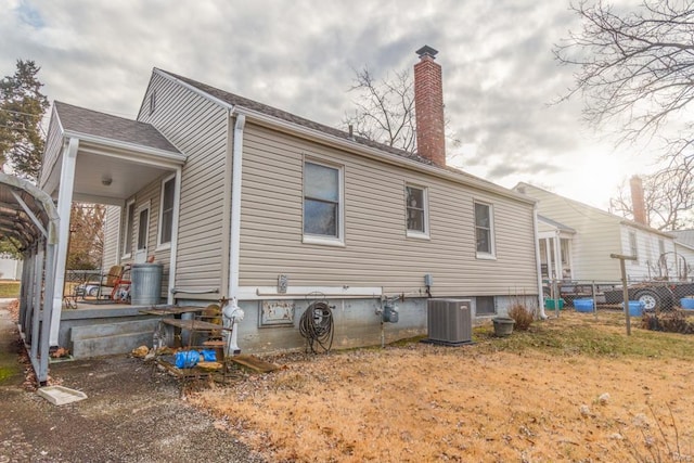 view of side of property featuring central AC