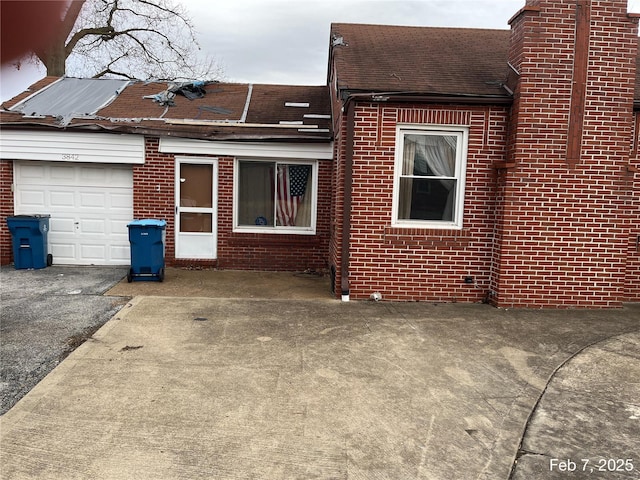 view of side of property with a garage