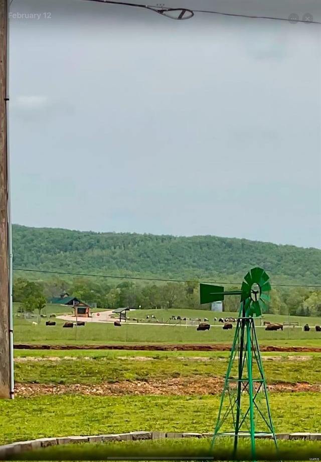 view of mountain feature with a rural view