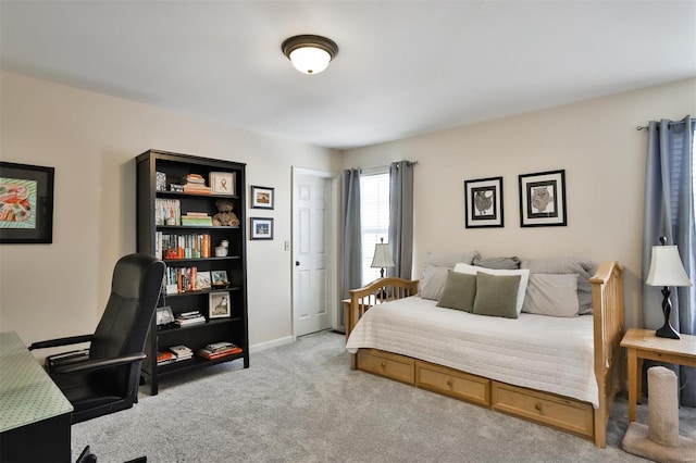 bedroom featuring light carpet