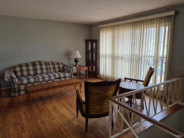 sitting room featuring hardwood / wood-style floors and a wealth of natural light