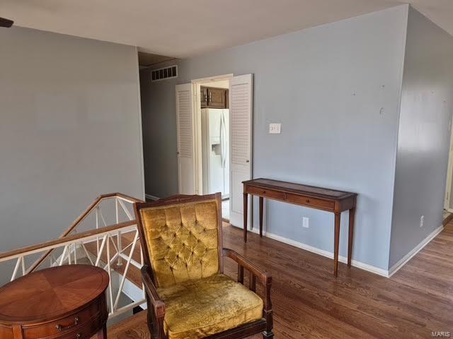 sitting room featuring wood-type flooring