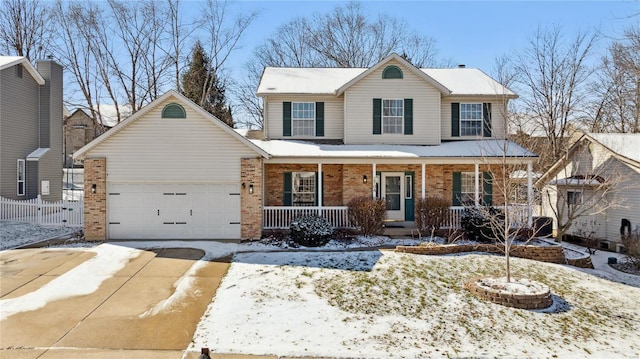 view of property featuring a garage and a porch