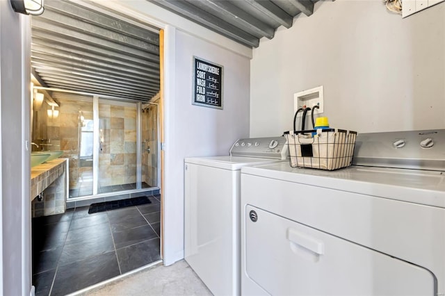 laundry area featuring washing machine and dryer and laundry area