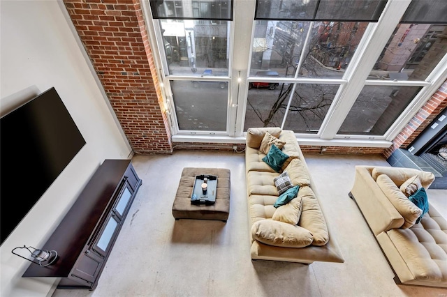 living room featuring brick wall