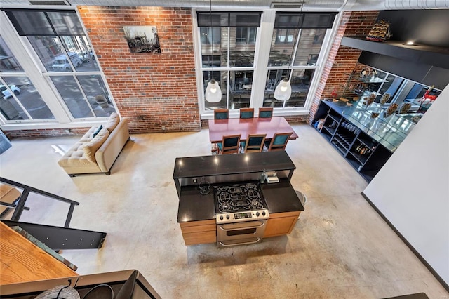 living area with brick wall